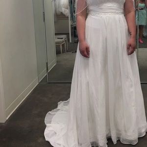 White wedding dress! Wore only to buy in store, size 14. Still has tags on